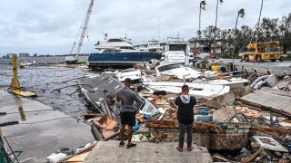 Boats are left stranded on the shore in the aftermath of Hurricane Ian in Fort Myers, Florida, on Sept. 29, 2022. Hurricane Ian left much of coastal southwest Florida in darkness early on Thursday, bringing "catastrophic" flooding that left officials readying a huge emergency response to a storm of rare intensity.