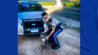 State trooper with a dog she rescued