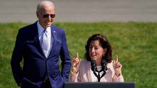 FILE - President Joe Biden looks on as Secretary of Commerce Gina Raimondo speaks before the President signs the "CHIPS and Science Act of 2022" during a ceremony on the South Lawn of the White House, Aug. 9, 2022, in Washington.