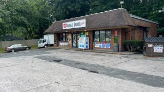 A man was shot and killed in the parking lot of this grocery store on Colonial Avenue in Waterbury Tuesday morning, according to police.