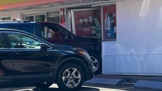 Two people were injured after an SUV crashed into a gas station convenience store on Broad Street in Hartford Saturday morning.