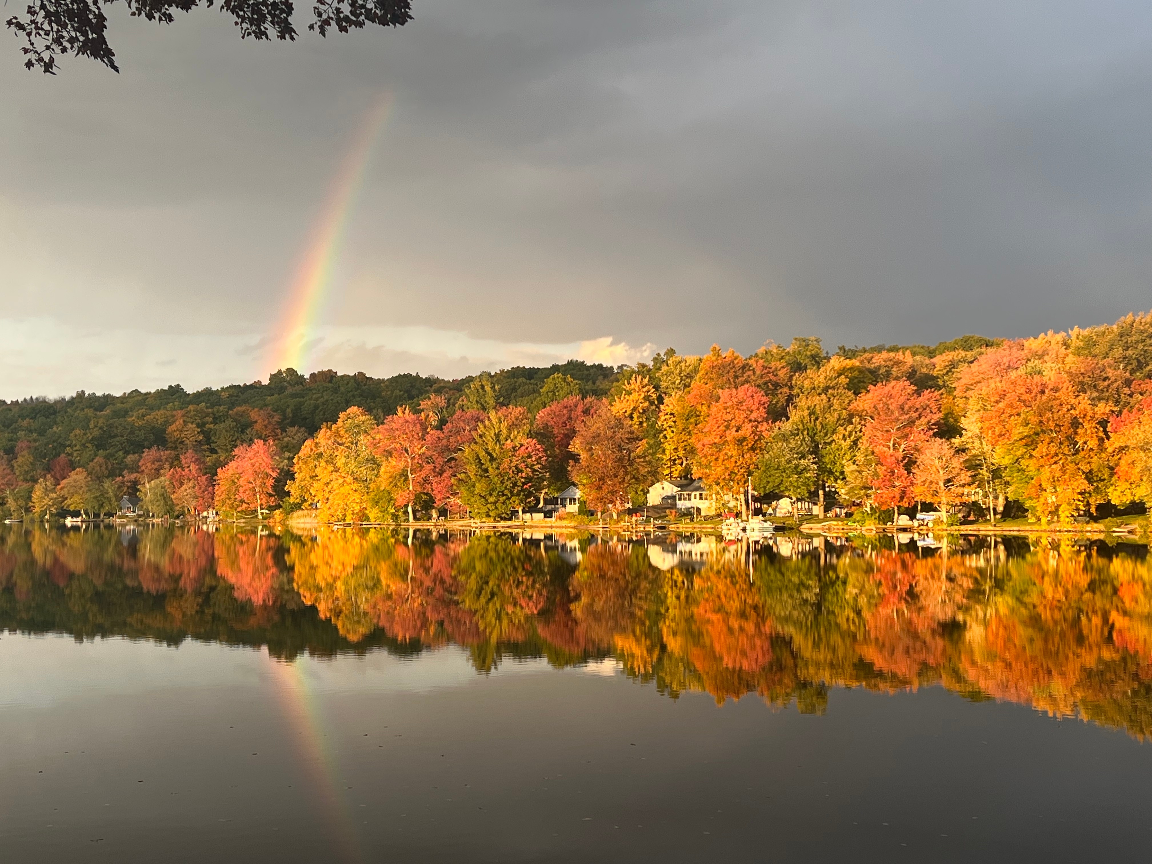 A rainbow over fall foliage on Long Meadow Pond in Bethlehem. Photo by Mike Hardt