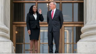Justice Ketanji Brown Jackson, left, is escorted by Chief Justice of the United States John Roberts following her formal investiture ceremony at the Supreme Court in Washington,