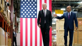 President Joe Biden listens as IBM Chairman and CEO Arvind Krishna, right, speaks during a tour of an IBM facility in Poughkeepsie, N.Y., on Thursday Oct. 6, 2022.