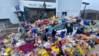 Memorial outside the Bristol Police Department honoring Lt. Dustin DeMonte and Sgt. Alex Hamzy