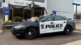 Flowers on a Bristol police cruiser