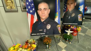 Pictures of Sgt. Dustin DeMonte and Officer Alex Hamzy inside the police department.