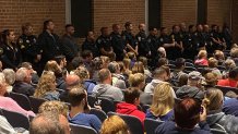 Officers attend the vigil at Bristol Eastern High School.