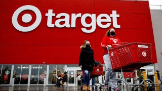 Shoppers exit a Target store in Brooklyn, New York, November 26, 2021.