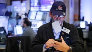 Traders work on the trading floor at the New York Stock Exchange (NYSE) in Manhattan, New York City, U.S., November 11, 2022.