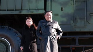 This undated photo provided on Nov. 27, 2022, by the North Korean government shows North Korean leader Kim Jong Un, right, and his daughter, left
