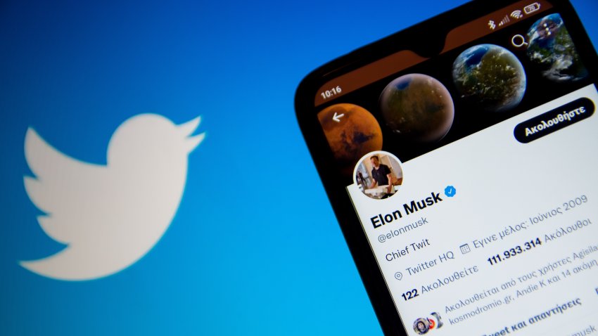 In this photo illustration Elon Musk Twitter seen displayed on a smartphone screen with Twitter logo in the background in Athens, Greece on October 30, 2022. Elon Musk begins his Twitter ownership with firings. (Photo by Nikolas Kokovlis/NurPhoto via Getty Images)