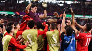Yassine 'Bono' Bounou of Morocco is thrown in the air by his teammates after the penalty shootout during the FIFA World Cup Qatar 2022 Round of 16 match between Morocco and Spain at Education City Stadium, Dec. 6, 2022, in Al Rayyan, Qatar.