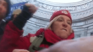 This image from U.S. Capitol Police body-worn video that was in the government sentencing memorandum in the case shows Jacquelyn Starer, a physician from Massachusetts, striking a police officer in the Rotunda of the U.S. Capitol on Jan. 6, 2021, in Washington.