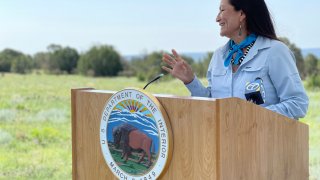 In this photo released by the Office of the Secretary Department of the Interior, U.S. Interior Secretary Deb Haaland speaks at the Sabinoso Wilderness in Las Vegas, N.M., July 17, 2021.