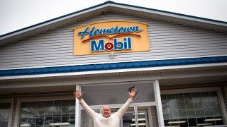 A Mega Millions ticket purchased in Lebanon, Maine, matched the winning numbers for the estimated $1.35 billion grand prize for the Mega Millions lottery game on Friday, Jan. 13, 2023. Fred Cotreau, owner of Hometown Gas & Grill stands in front of the convenience store where the winning ticket was sold on either Thursday or Friday.
