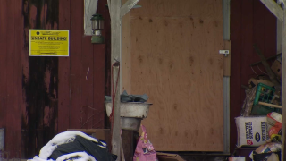 A sign is displayed on a barn at a Beacon Falls farm.