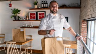 Matt Baker, chef and owner of Gravitas, poses for a portrait inside the restaurant, Feb. 14, 2023, in Washington.