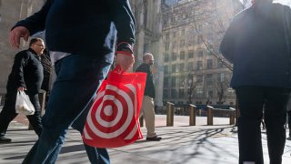 People walk along 5th Avenue in Manhattan, one of the nation’s premier shopping streets on February 15, 2023 in New York City.
