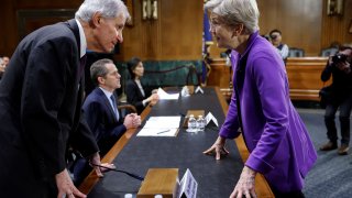 U.S. Senator Elizabeth Warren (D-MA) speaks to Federal Deposit Insurance Corporation Chairman Martin J. Gruenberg before a Senate Banking, Housing and Urban Affairs Committee hearing on “Recent Bank Failures and the Federal Regulatory Response” on Capitol Hill in Washington, March 28, 2023.