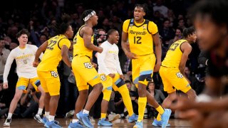 Marquette's Chase Ross (5) and Olivier-Maxence Prosper (12) celebrate after closing the second half of an NCAA college basketball game during the semifinals of the Big East conference tournament, Friday, March 10, 2023, in New York.