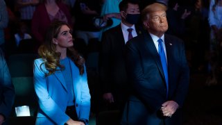 FILE - Then-President Donald Trump attends church at International Church of Las Vegas with counselor Hope Hicks, left, Sunday, Oct. 18, 2020, in Las Vegas, Nev.