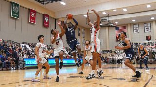 Yale Bulldogs guard Bez Mbeng (2) shoots the ball during a college basketball game between the Yale Bulldogs and the Brown Bears on March 4, 2023, at the Pizzitola Sports Center in Providence, RI.