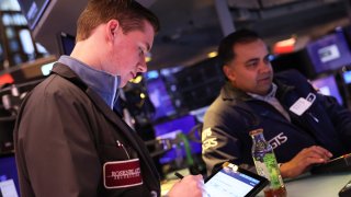 Traders work on the floor of the New York Stock Exchange during morning trading on April 10, 2023 in New York City.