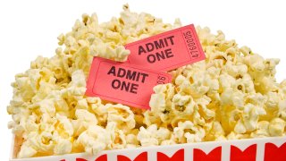 Bucket of Popcorn With Movie Tickets