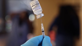 A pharmacist prepares to administer COVID-19 vaccine booster shots during an event hosted by the Chicago Department of Public Health at the Southwest Senior Center on September 09, 2022 in Chicago, Illinois.