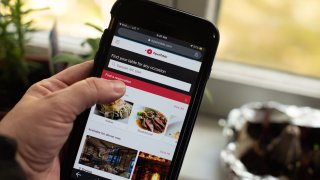 The OpenTable website on a mobile phone arranged in Dobbs Ferry, New York, May 1, 2021.