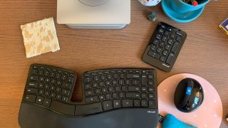 Brittany Matter’s home desk features the mouse, keyboard and number pad that come in the Microsoft Sculpt Ergonomic Desktop set, which has been discontinued. She sticks the keyboard in a backpack when she travels, because she likes to be comfortable when she works.