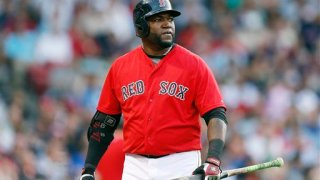 Boston Red Sox’s David Ortiz walks to the dug out after grounding out during the first inning of a baseball game against the New York Yankees in Boston, Friday, July 10, 2015.