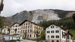 Residential buildings stand in front of the “Brienzer Rutsch” the rockfall danger zone in Brienz-Brinzauls, Switzerland, Friday, May 12, 2023.