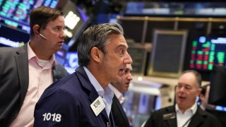 Traders work on the floor of the New York Stock Exchange (NYSE) May 30, 2023.