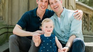 Stephen Hanna, left, with his husband, Bret Shuford, and their son, Maverick.
