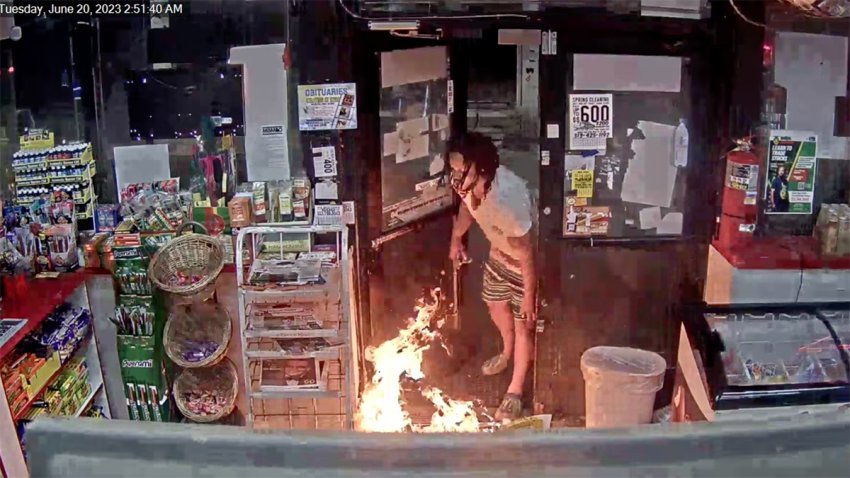 Screenshot shows man using blowtorch to set fire to Detroit gas station.