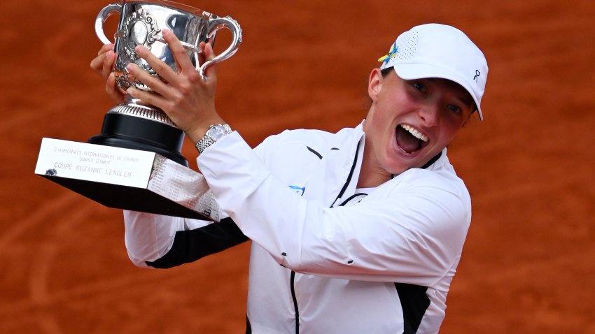 PARIS, FRANCE – JUNE 10: Iga Swiatek of Poland celebrates with her winners trophy after victory against Karolina Muchova of Czech Republic in the Women’s Singles Final match on Day Fourteen of the 2023 French Open at Roland Garros on June 10, 2023 in Paris, France.