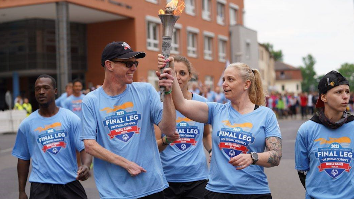 Healthcare worker celebrates Special Olympics World Games as torch