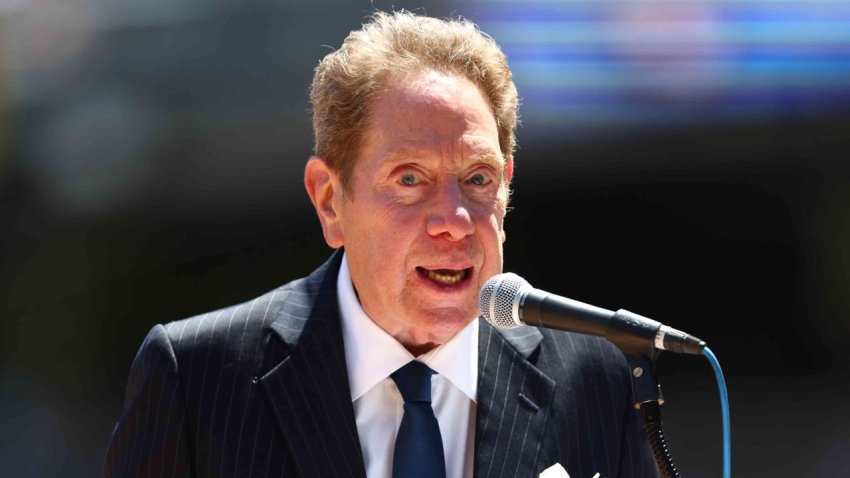 New York Yankees radio broadcaster John Sterling emcees the Old Timers Day Ceremony before a game between the Kansas City Royals and New York Yankees at Yankee Stadium on July 30, 2022 in New York City.