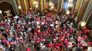 Protesters gather at the Iowa Capitol rotunda to voice opposition to the new ban on abortion after roughly six weeks of pregnancy introduced by Republican lawmakers in a special session in Des Moines, Iowa on Tuesday, July 11, 2023.