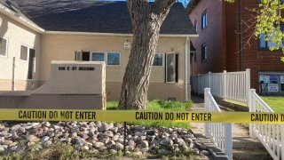 FILE – The fire-damaged Wellspring Health Access clinic is cordoned by tape, May 25, 2022, in Casper, Wyo. A judge is set to consider a plea deal Thursday, July 20, 2023, for an abortion opponent who investigators say burned Wyoming’s first full-service abortion clinic in years.