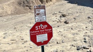 Heat warning sign at Death Valley National Park.
