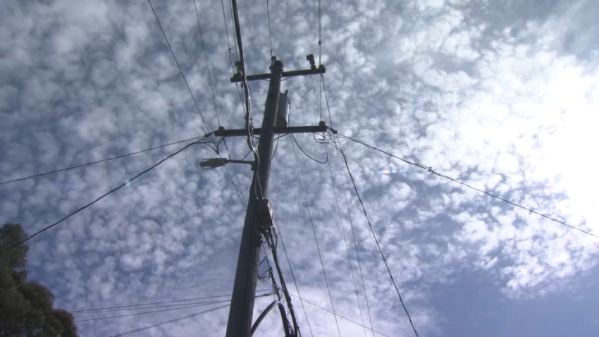 A power line against clouds. FILE