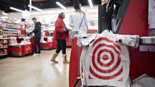 Plastic bags hang on a self checkout kiosk at a Target Corp. store in Chicago, Illinois.