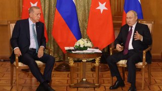 Russian President Vladimir Putin (R) talks to Turkish President Recep Tayyip Erdogan (L) during their meeting on September 4, 2023 in Sochi, Russia.