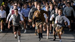 People run to enter the 188th 'Oktoberfest' beer festival in Munich, Germany,