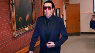 Musical artist Marilyn Manson, whose legal name is Brian Hugh Warner, leaves after appearing in Belknap Superior Court,Monday, Sept. 18, 2023, in Laconia, N.H. Manson, who was charged with charged with two misdemeanor counts of simple assault, was accused of approaching a videographer at his 2019 concert in New Hampshire and allegedly spitting and blowing his nose on her.