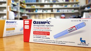 In this photo illustration, boxes of the diabetes drug Ozempic rest on a pharmacy counter in Los Angeles, April 17, 2023.