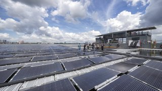 The floating solar photovoltaic power plant by EDPR Sunseap Group, a unit of Energias de Portugal SA, in Woodlands, in Singapore, on Wednesday, Dec. 7, 2022.